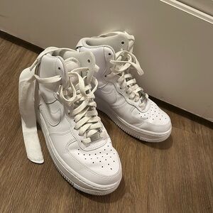 Size 7.5 ￼ high top white Air Force 1 Nikes ￼￼